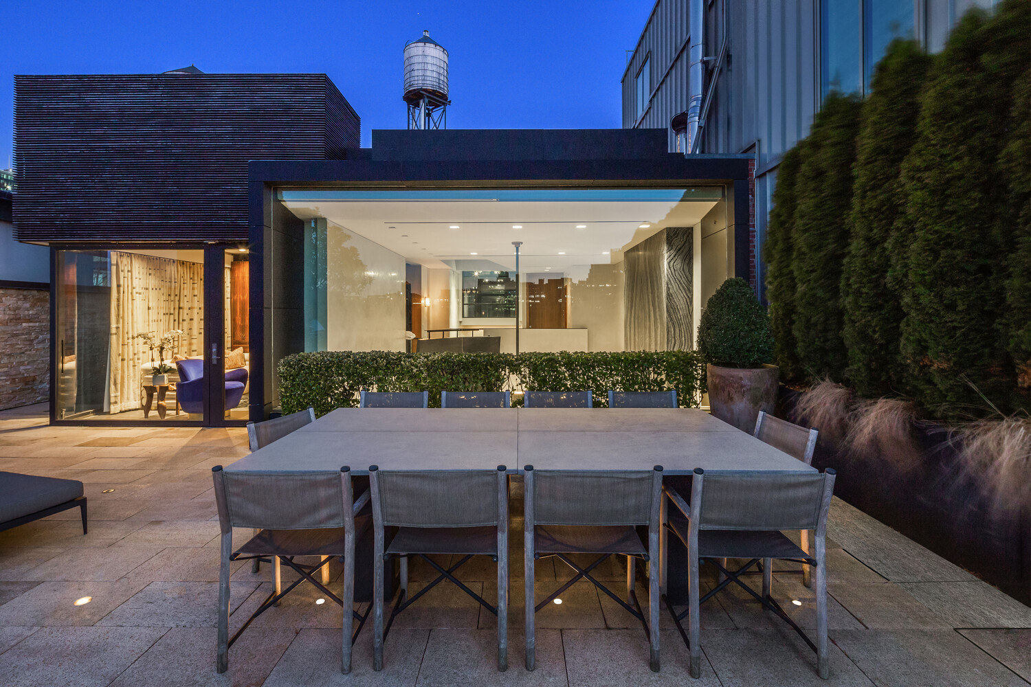 459 West Broadway, Unit PHS Manhattan, NY 10012 - Photo 15 of 17 a view of a patio with table and chairs and potted plants
