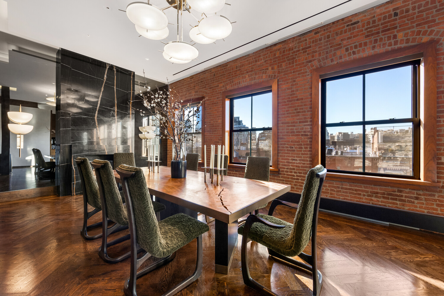 459 West Broadway, Unit PHS Manhattan, NY 10012 - Photo 5 of 17 a view of a dining room with furniture window and wooden floor