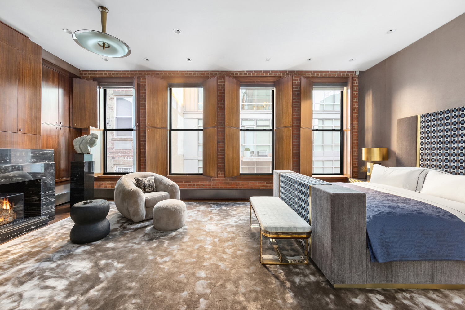 459 West Broadway, Unit PHS Manhattan, NY 10012 - Photo 6 of 17 a living room with furniture and a fireplace