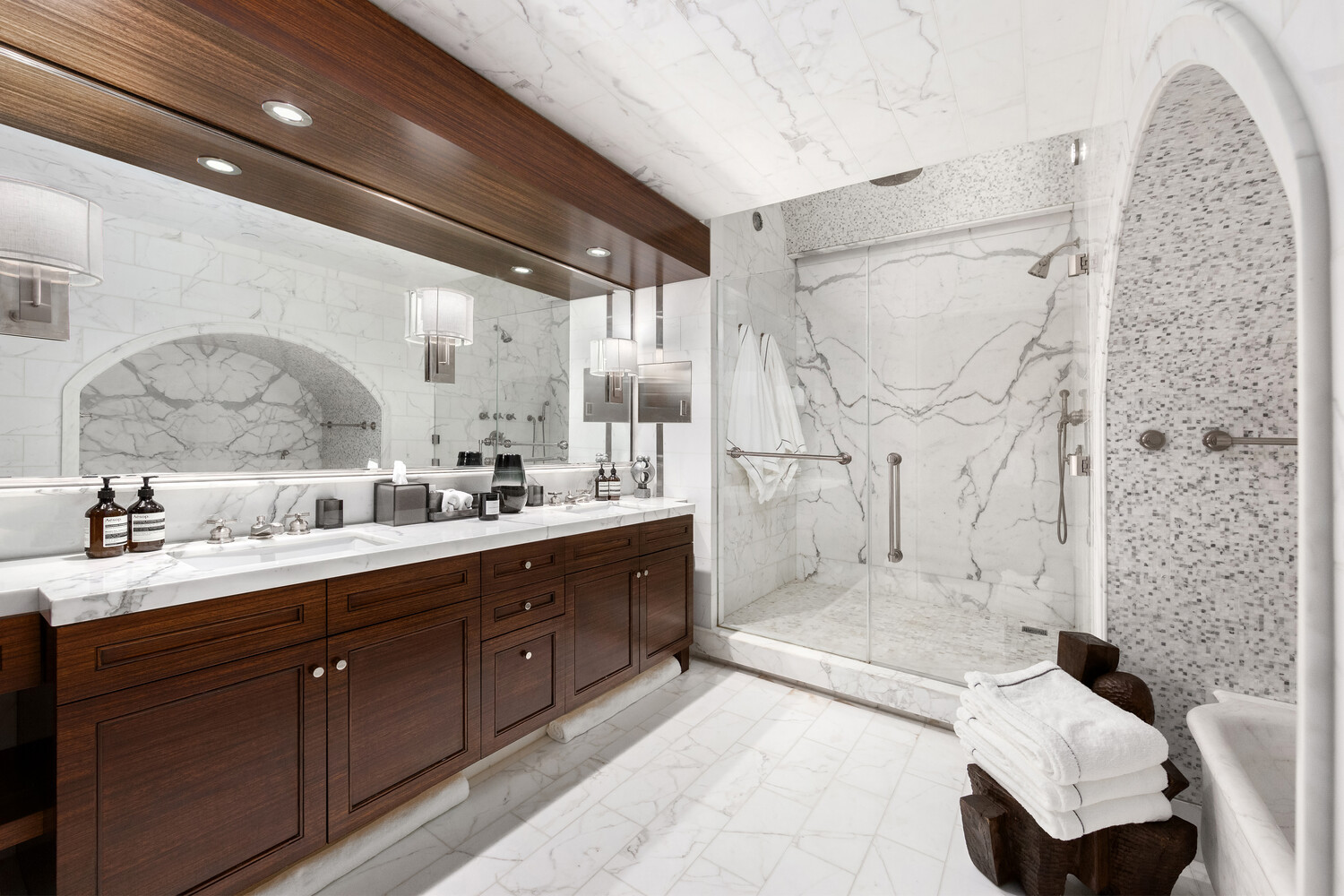 459 West Broadway, Unit PHS Manhattan, NY 10012 - Photo 7 of 17 a large bathroom with a granite countertop sink mirror and bathtub