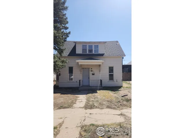 a view of a living room with a large window