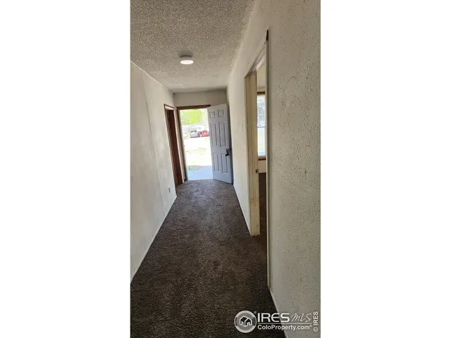 a view of a hallway with windows