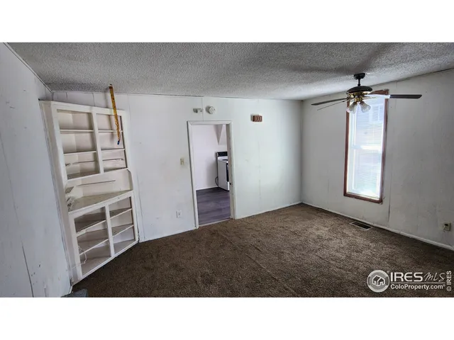 a room with a bed and a walk in closet