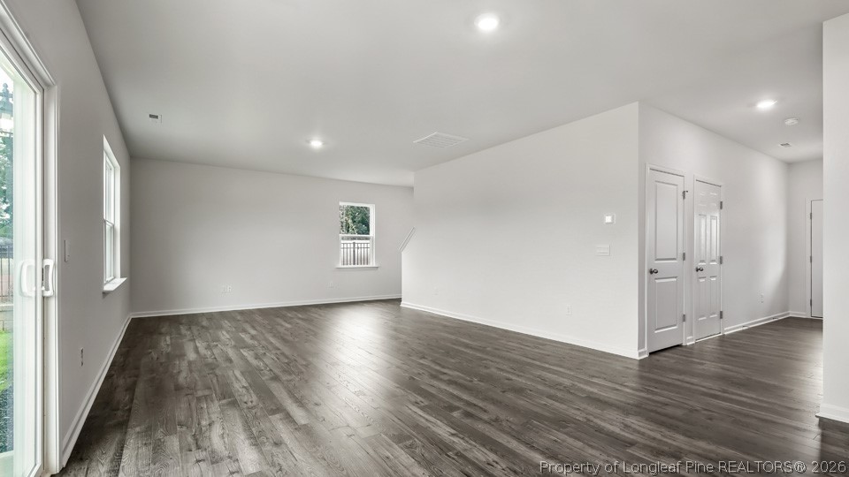81 Discovery Way Spring Lake, NC 28390 - Photo 11 of 32 a view of wooden floor and windows in an empty room