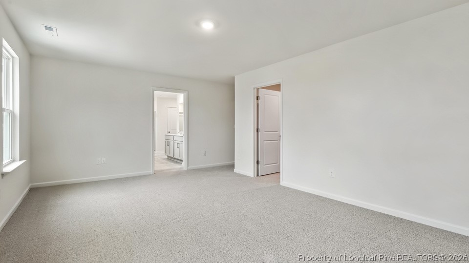 81 Discovery Way Spring Lake, NC 28390 - Photo 14 of 32 an empty room with windows and closet