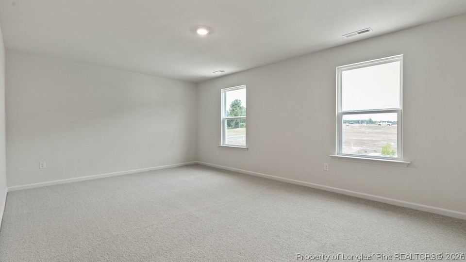 81 Discovery Way Spring Lake, NC 28390 - Photo 16 of 32 an empty room with windows