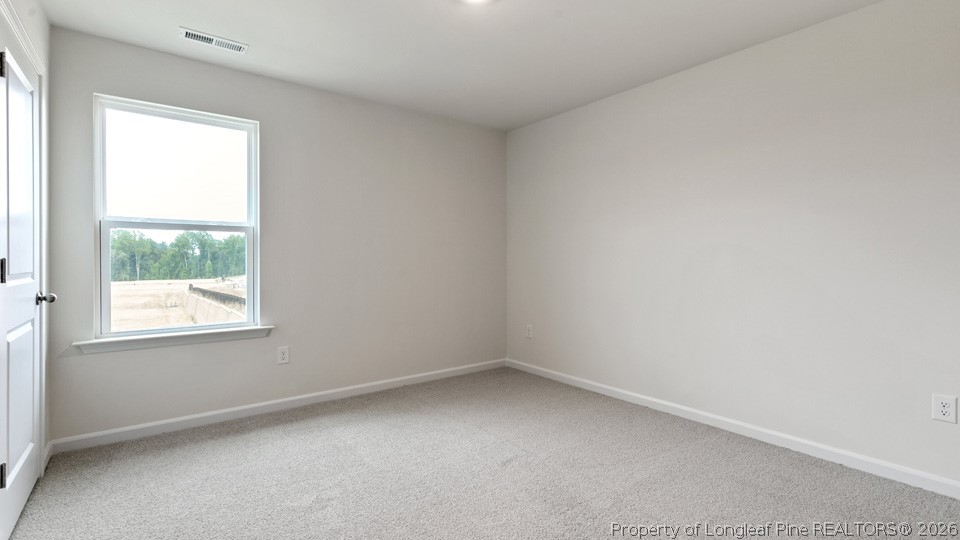 81 Discovery Way Spring Lake, NC 28390 - Photo 18 of 32 an empty room with a window