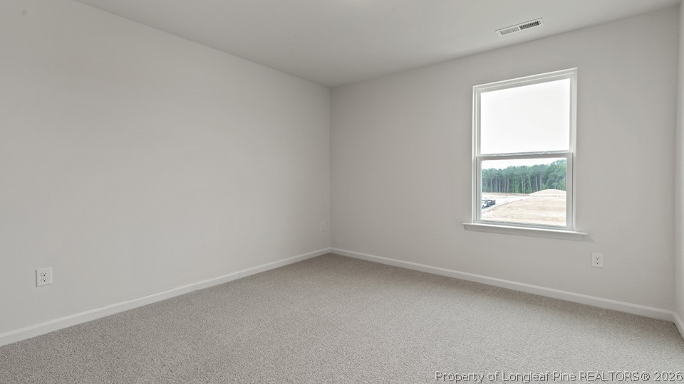 81 Discovery Way Spring Lake, NC 28390 - Photo 20 of 32 an empty room with a window