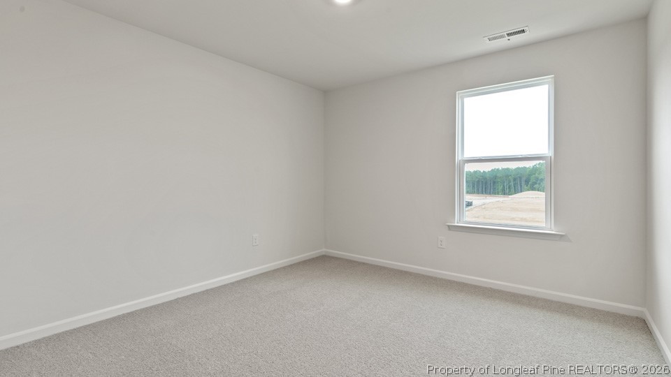 81 Discovery Way Spring Lake, NC 28390 - Photo 22 of 32 an empty room with a window