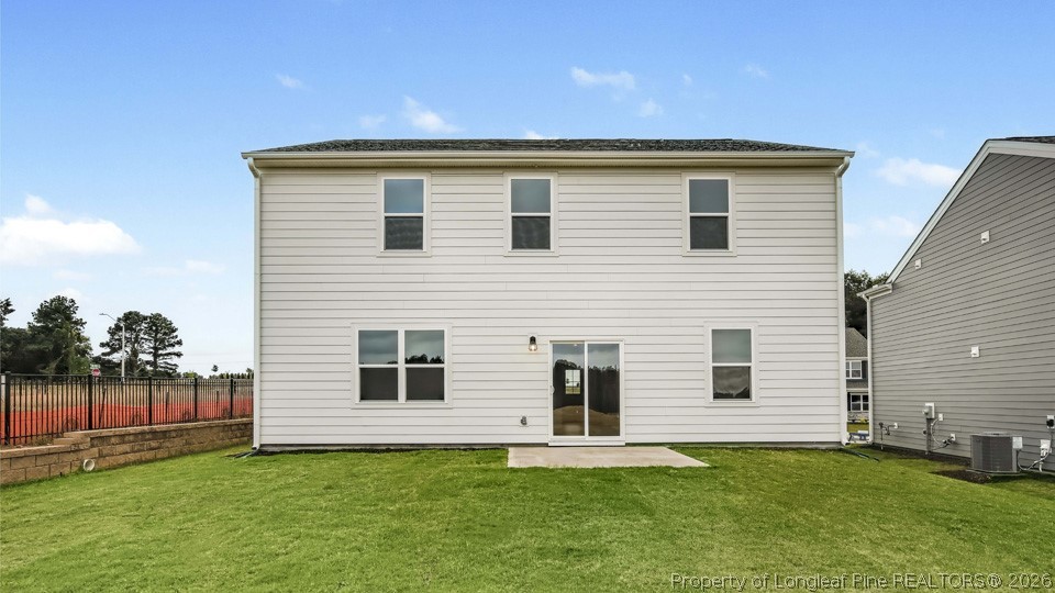 81 Discovery Way Spring Lake, NC 28390 - Photo 29 of 32 a backyard of a house with lots of green space
