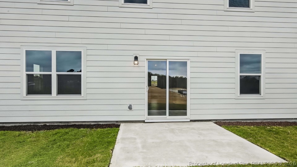 81 Discovery Way Spring Lake, NC 28390 - Photo 30 of 32 a view of a house with a yard