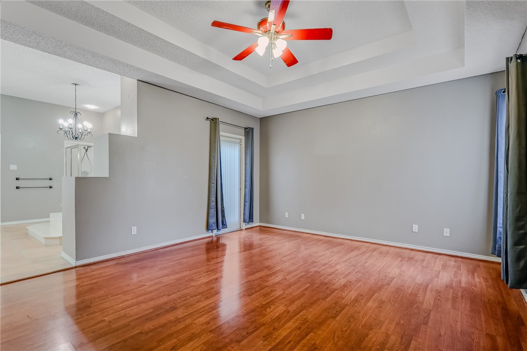 5917 Harvest Hill Road Corpus Christi, TX 78414 - Photo 22 of 40 wooden floor in an empty room with a window