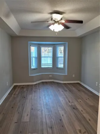 a view of a hallway view with wooden floor and staircase