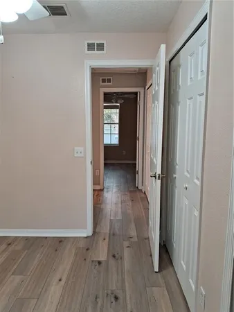 a view of an empty room with windows