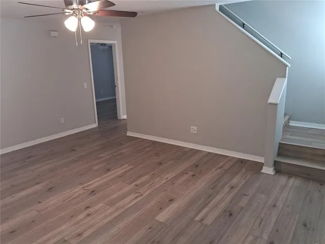 a kitchen with stainless steel appliances granite countertop a stove microwave and sink