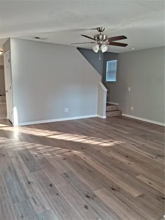 a view of an empty room with windows