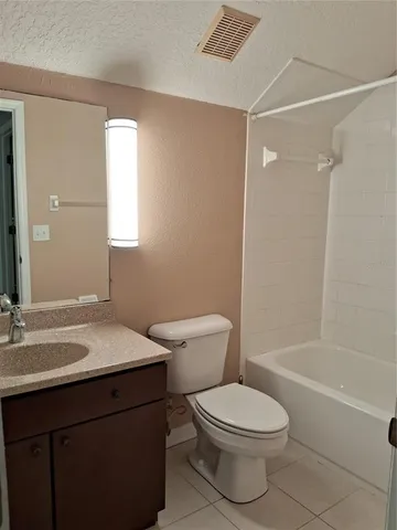 a bathroom with a toilet a sink and a bathtub