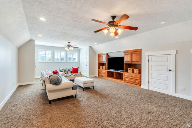 1355 West 1000 South Mapleton, UT 84664 - Photo 34 of 74 Living area featuring dark colored carpet, recessed lighting, and a ceiling fan