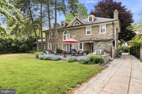 a front view of a house with garden and porch