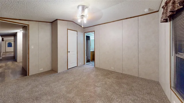 an empty room with a empty space and windows