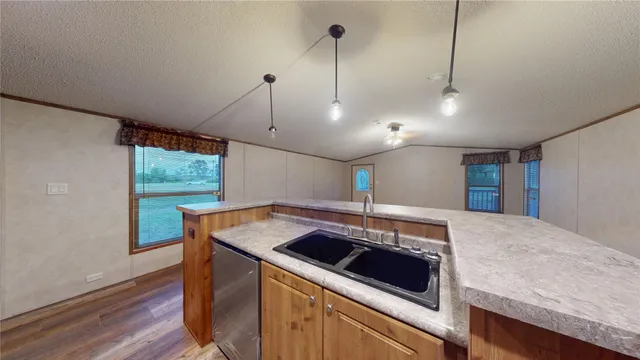 a kitchen with a stove and a sink