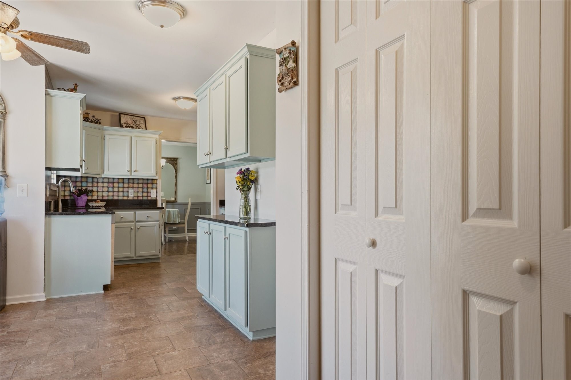 1510 Rapids Road Portland, TN 37148 - Photo 17 of 57 a kitchen with white cabinets and stainless steel appliances