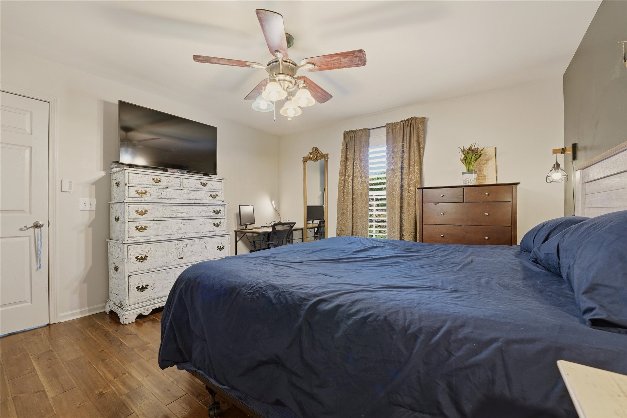 1510 Rapids Road Portland, TN 37148 - Photo 22 of 57 a bedroom with a bed and a flat screen tv