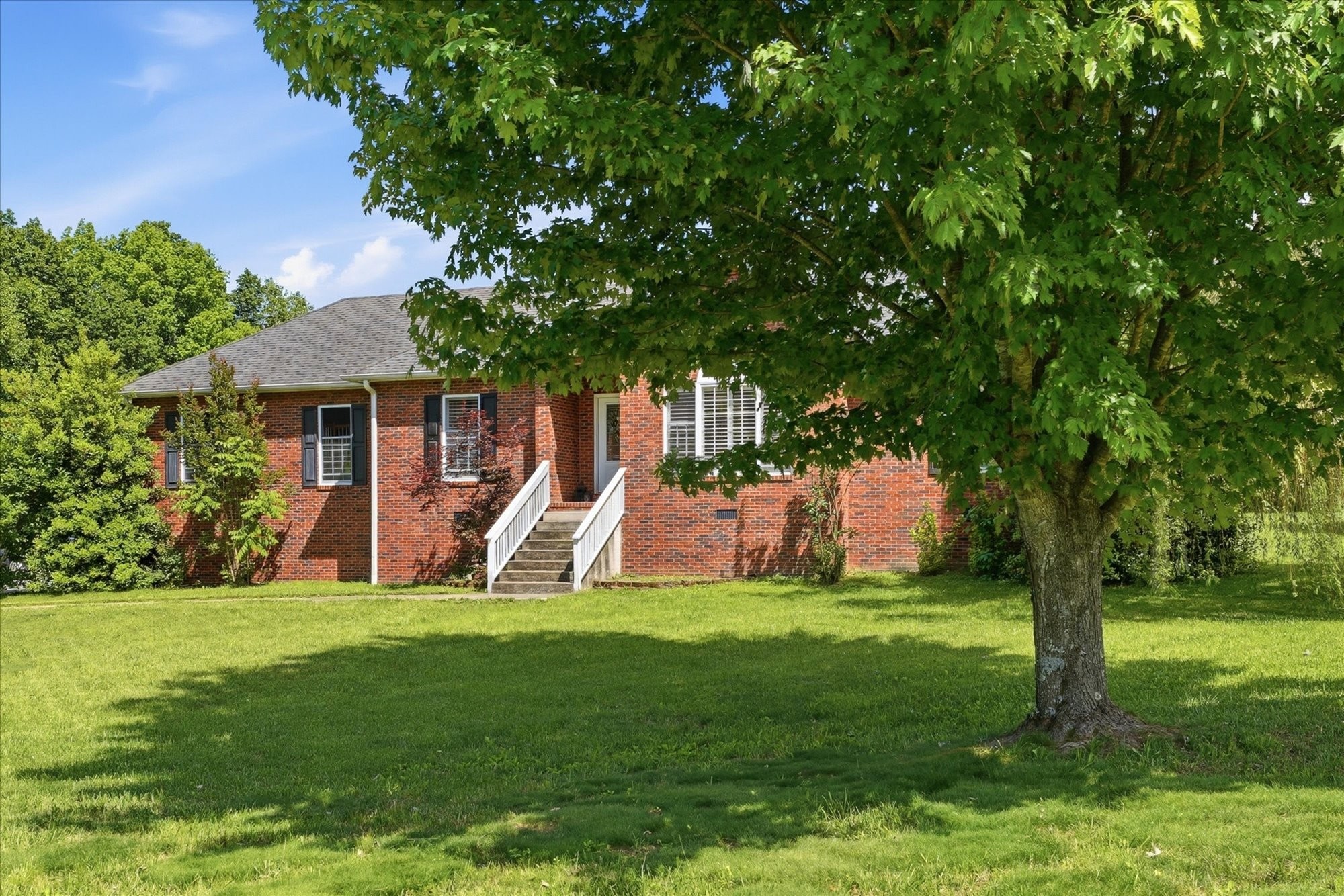 1510 Rapids Road Portland, TN 37148 - Photo 3 of 57 a view of a house with a big yard and large trees