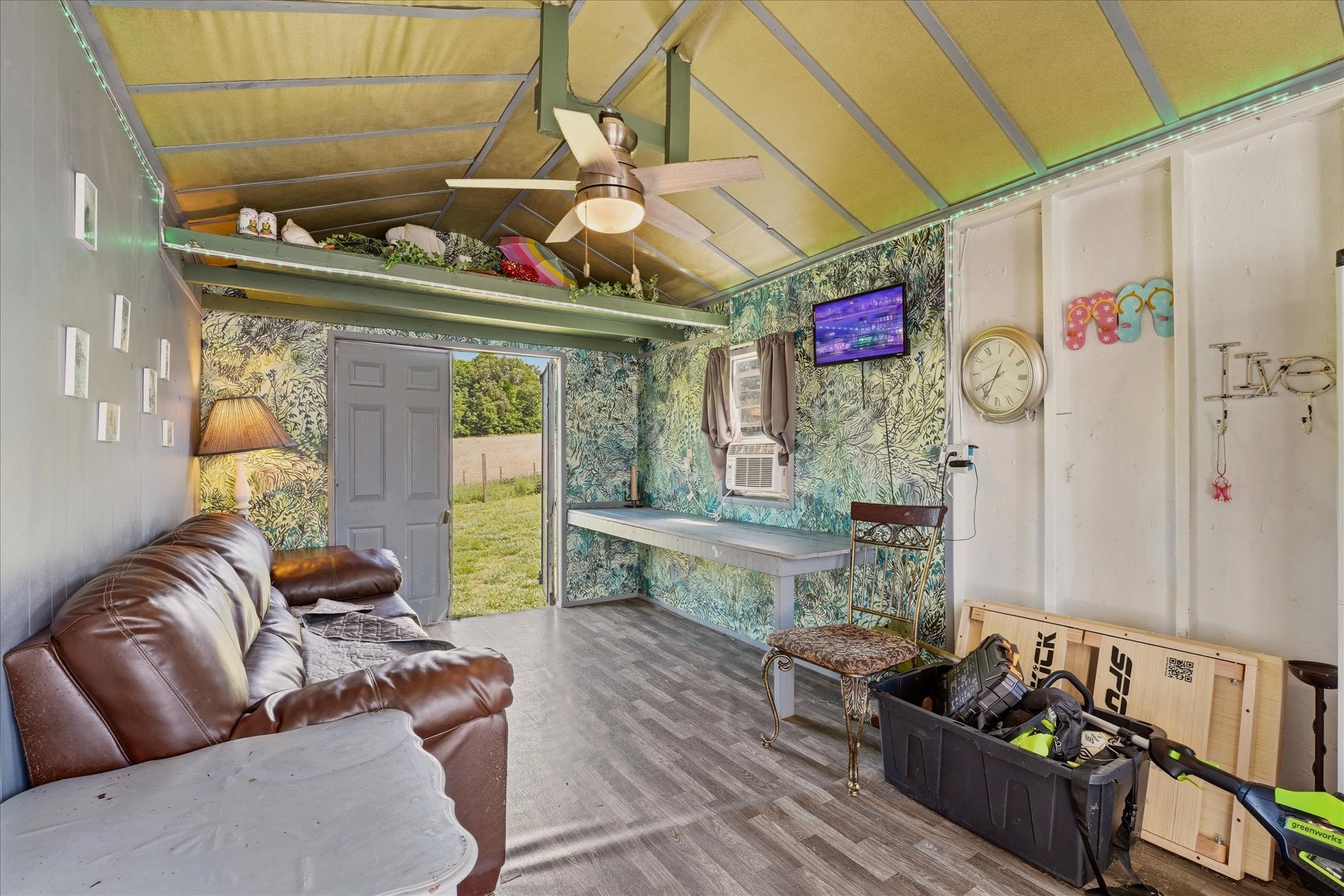 1510 Rapids Road Portland, TN 37148 - Photo 35 of 57 a living room with furniture and a wooden floor