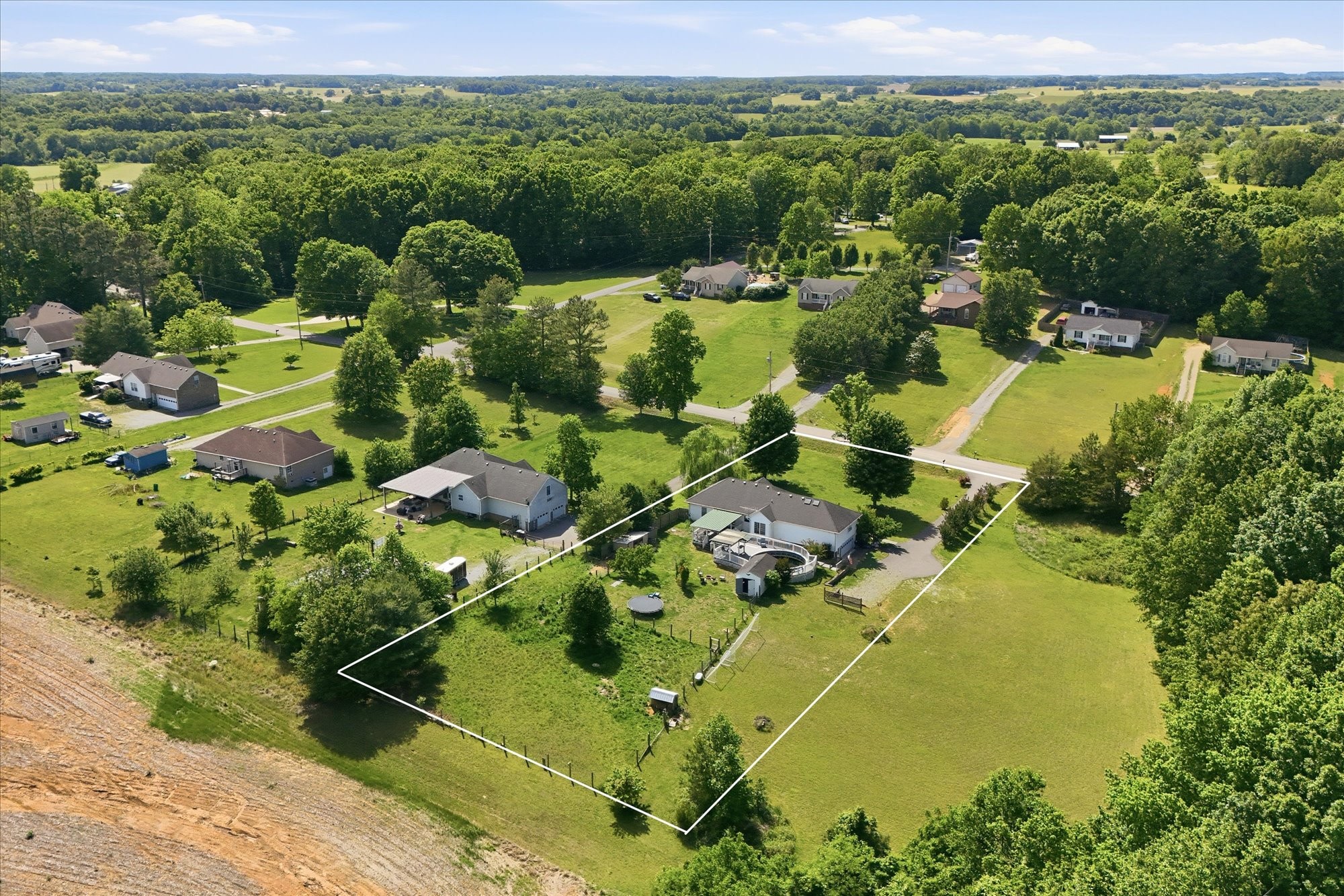 1510 Rapids Road Portland, TN 37148 - Photo 49 of 57 an aerial view of a residential houses with outdoor space and trees