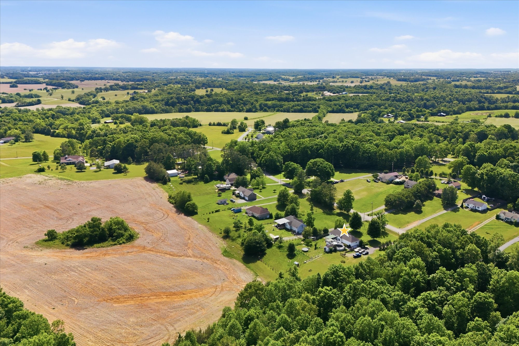 1510 Rapids Road Portland, TN 37148 - Photo 53 of 57 an aerial view of a city with lots of residential buildings ocean and mountain view in back