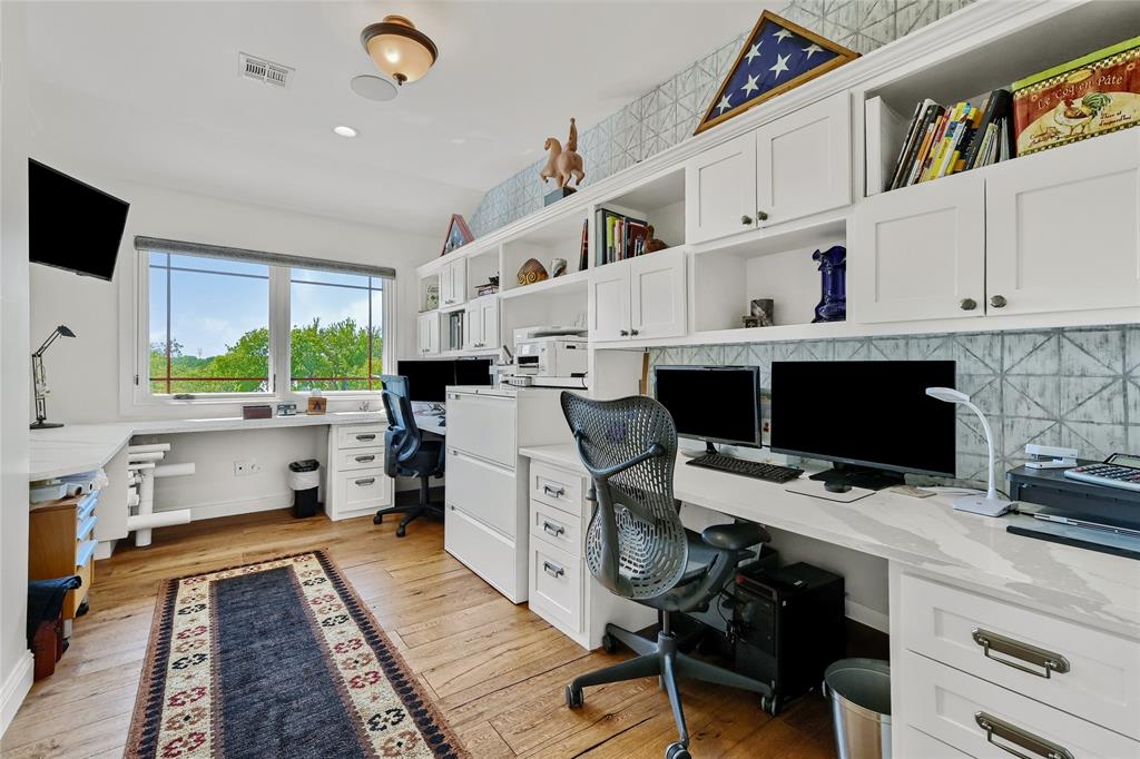 5555 County Road 179 Celina, TX 75009 - Photo 23 of 40 Office area with built in desk and light wood-style flooring