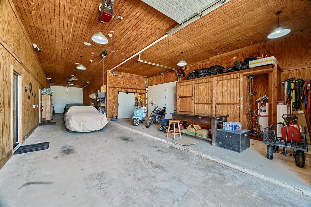 5555 County Road 179 Celina, TX 75009 - Photo 29 of 40 Garage featuring wooden walls