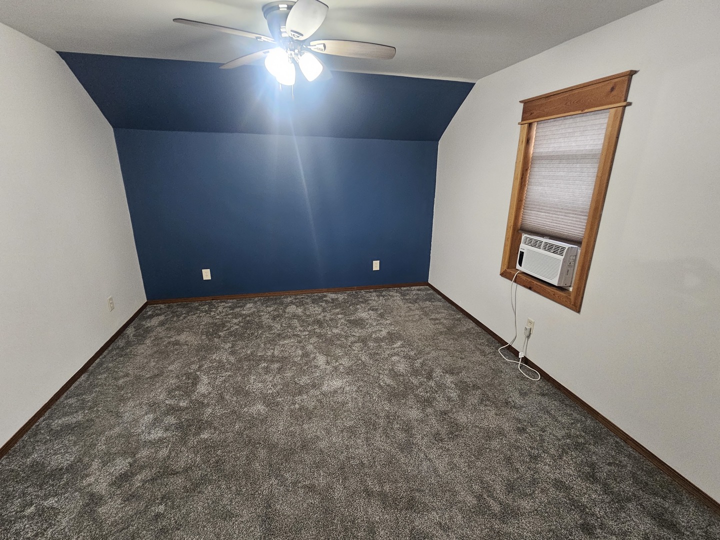 106 North Main Street Tampico, IL 61283 - Photo 4 of 16 a view of an empty room and a window
