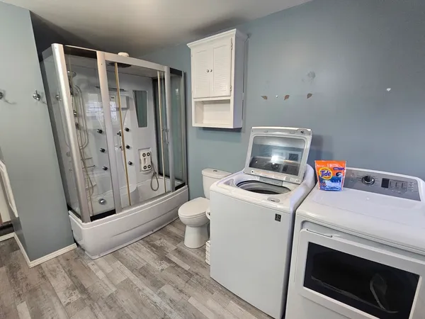 a utility room with dryer and washer