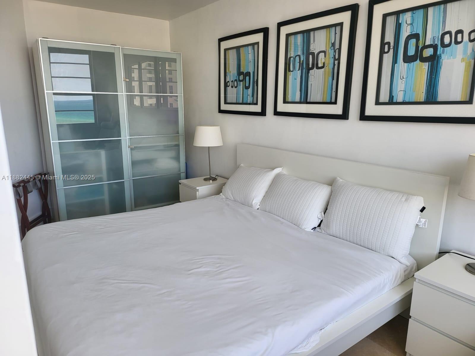 100 Lincoln Road, Unit 1238 Miami Beach, FL 33139 - Photo 11 of 31 a bedroom with a bed and a window