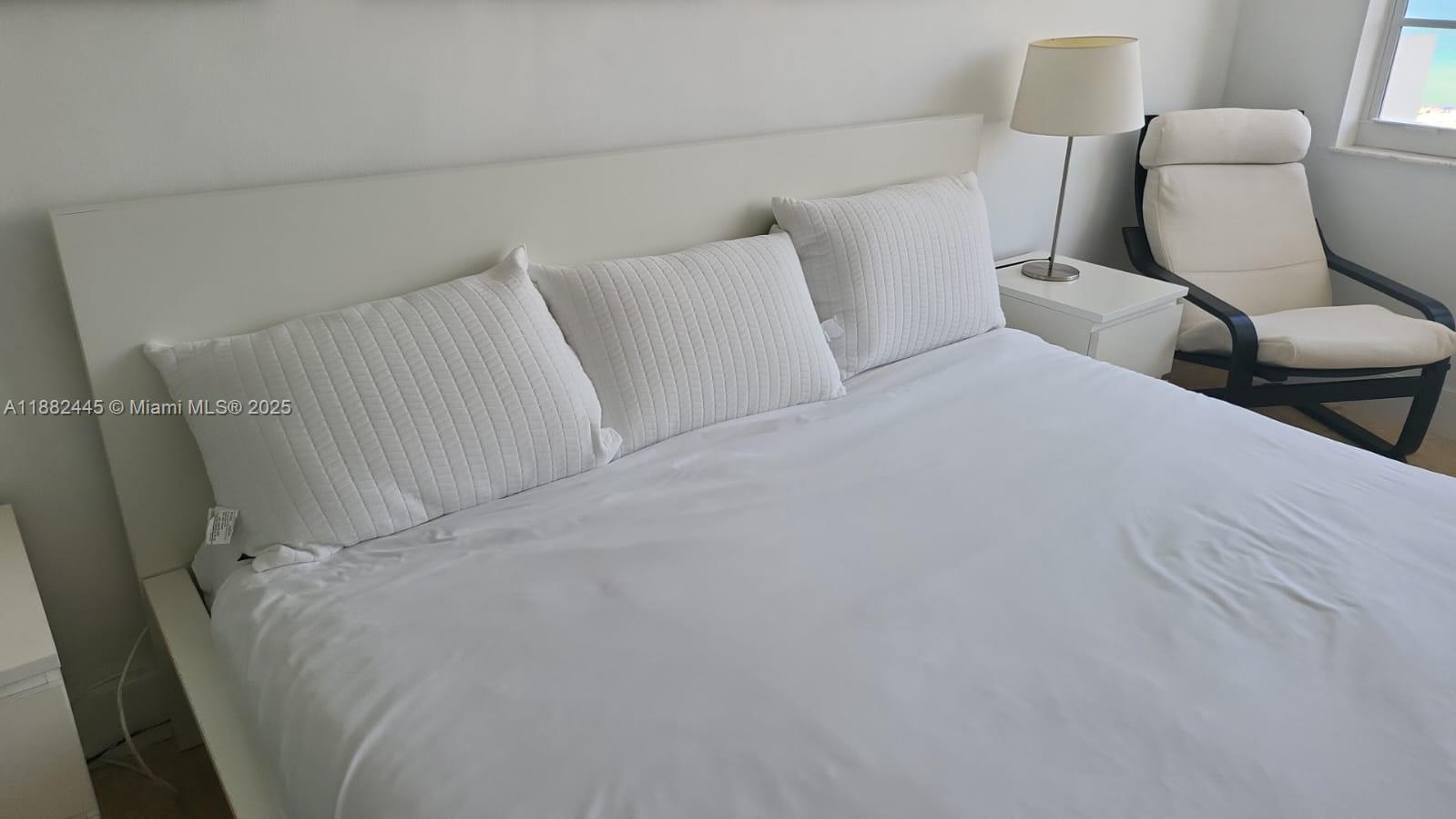 100 Lincoln Road, Unit 1238 Miami Beach, FL 33139 - Photo 8 of 31 a room with a bed and a chair