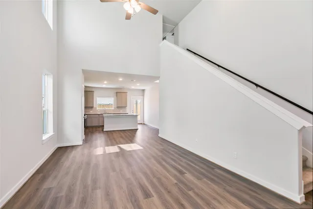 a view of a kitchen with wooden floor and a kitchen