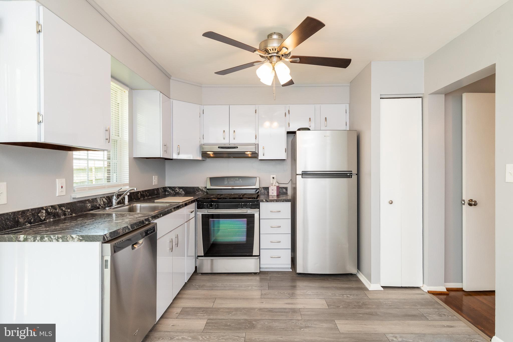 37 Cardor Court, Unit 37 Baltimore, MD 21236 - Photo 13 of 47 a kitchen with stainless steel appliances granite countertop a refrigerator a stove a sink and a refrigerator