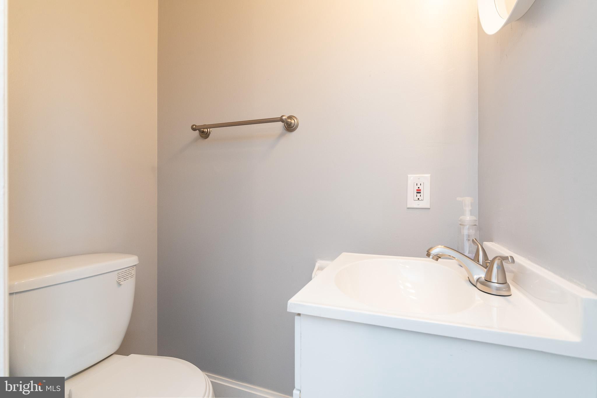 37 Cardor Court, Unit 37 Baltimore, MD 21236 - Photo 19 of 47 a bathroom with a sink a toilet and mirror