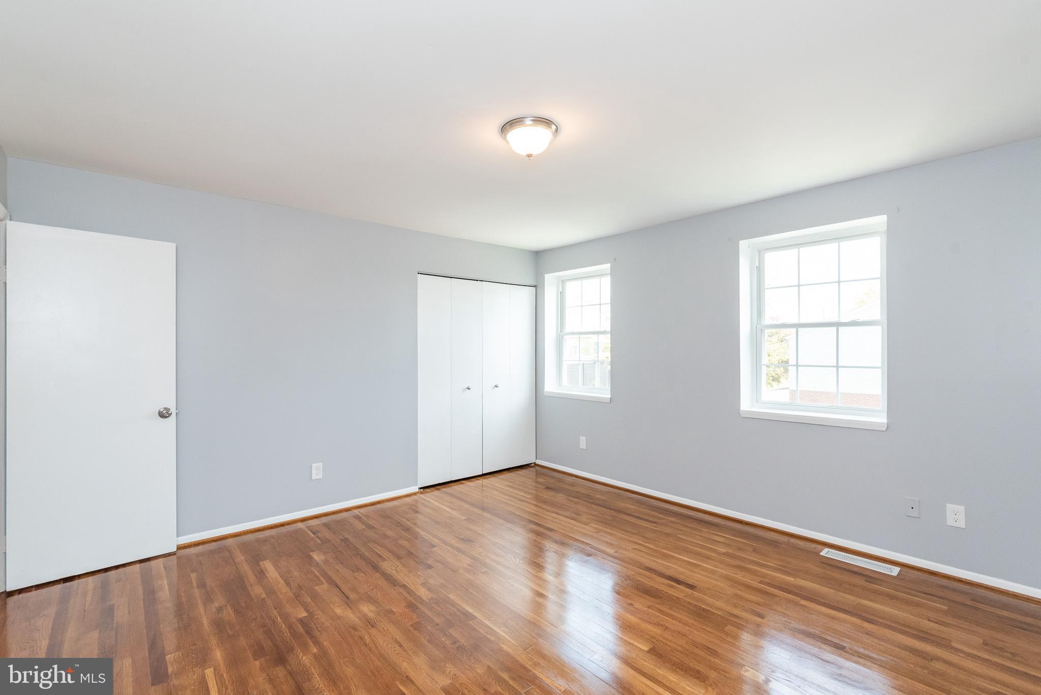 37 Cardor Court, Unit 37 Baltimore, MD 21236 - Photo 22 of 47 a view of empty room with wooden floor and fan
