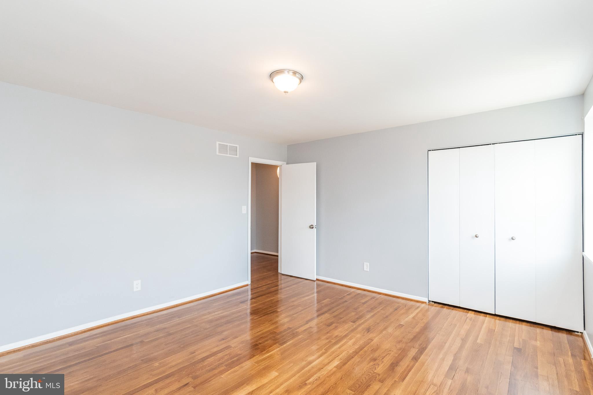 37 Cardor Court, Unit 37 Baltimore, MD 21236 - Photo 23 of 47 a view of an empty room with wooden floor