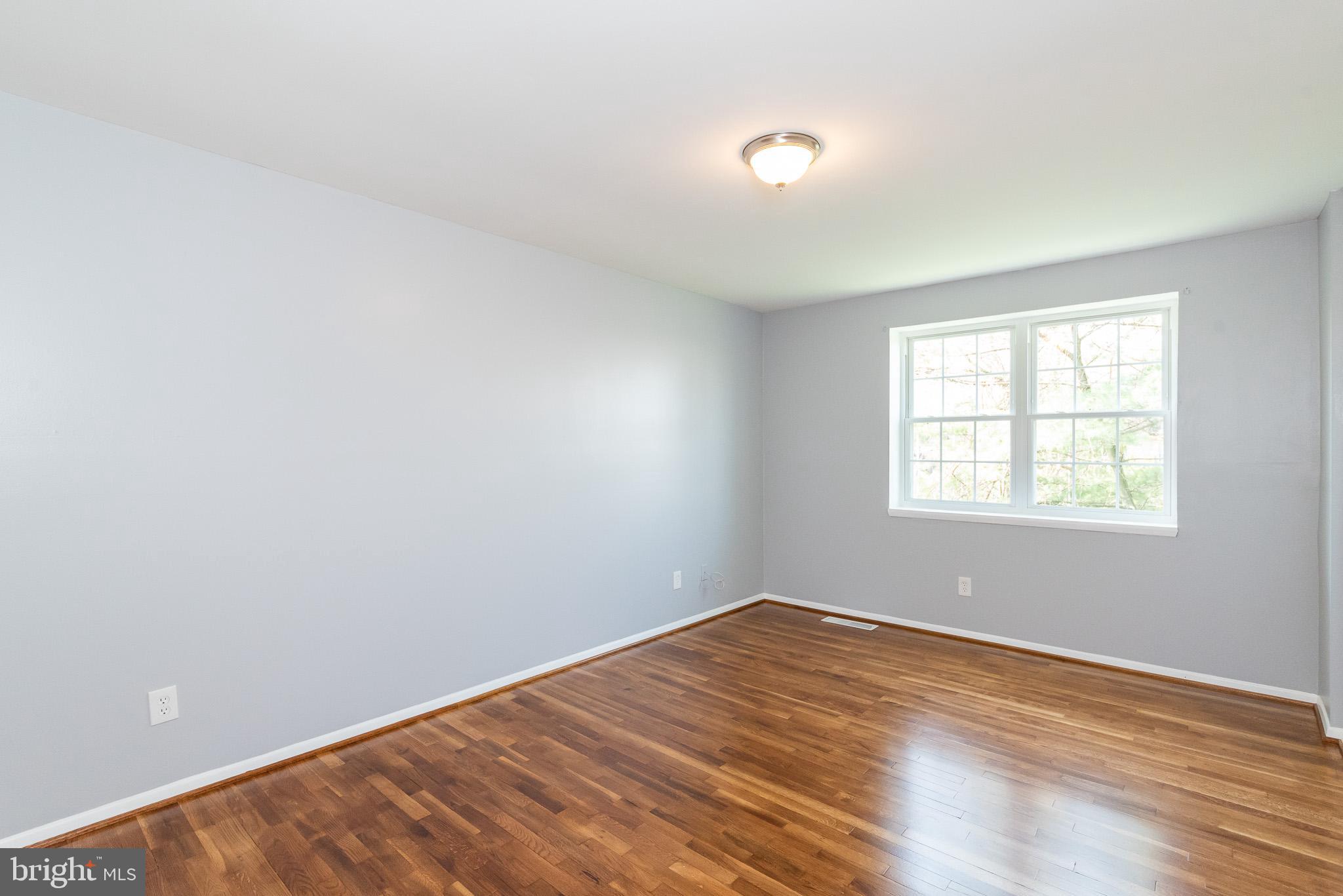 37 Cardor Court, Unit 37 Baltimore, MD 21236 - Photo 29 of 47 wooden floor in an empty room with a window