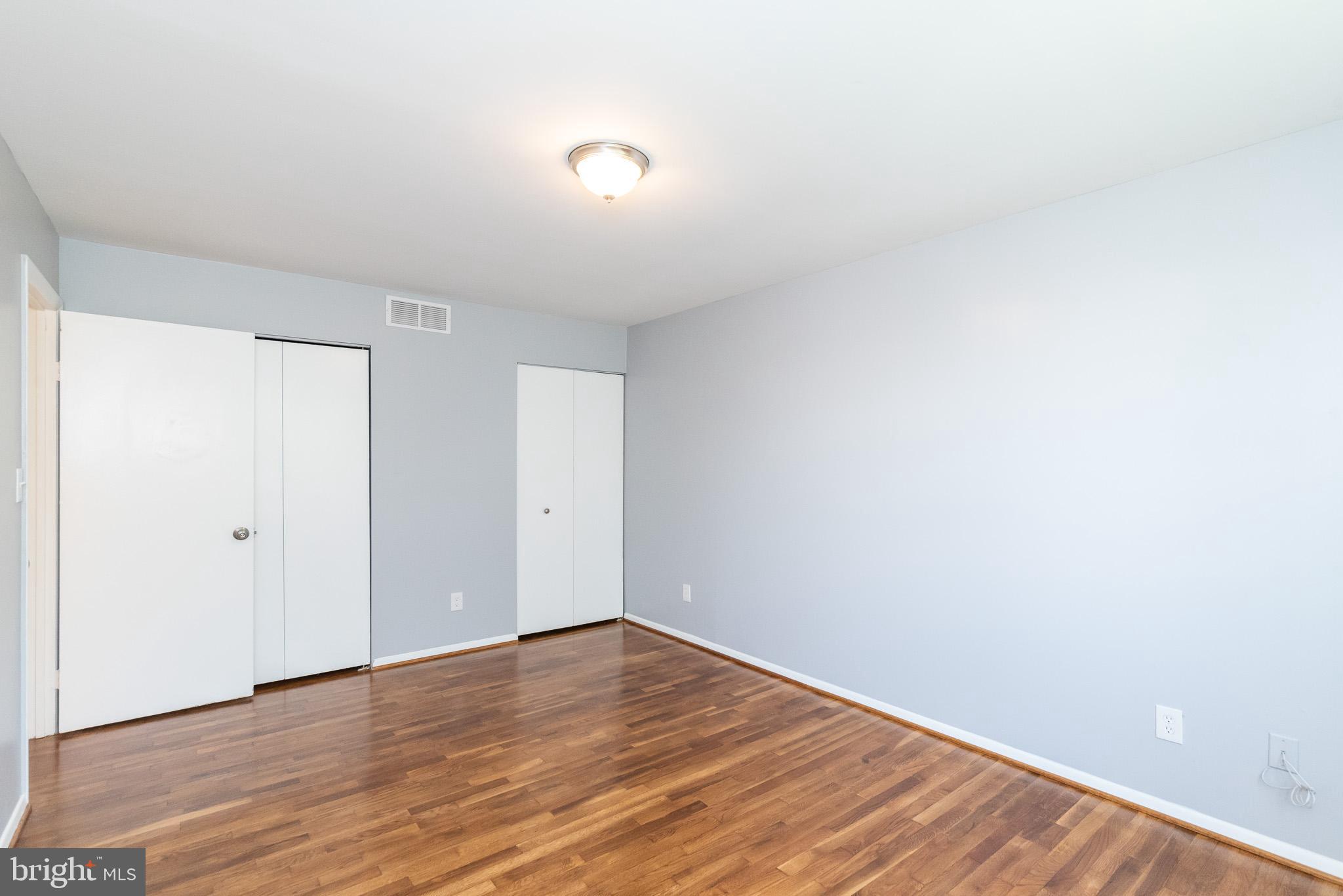 37 Cardor Court, Unit 37 Baltimore, MD 21236 - Photo 30 of 47 a view of an empty room with wooden floor and a window