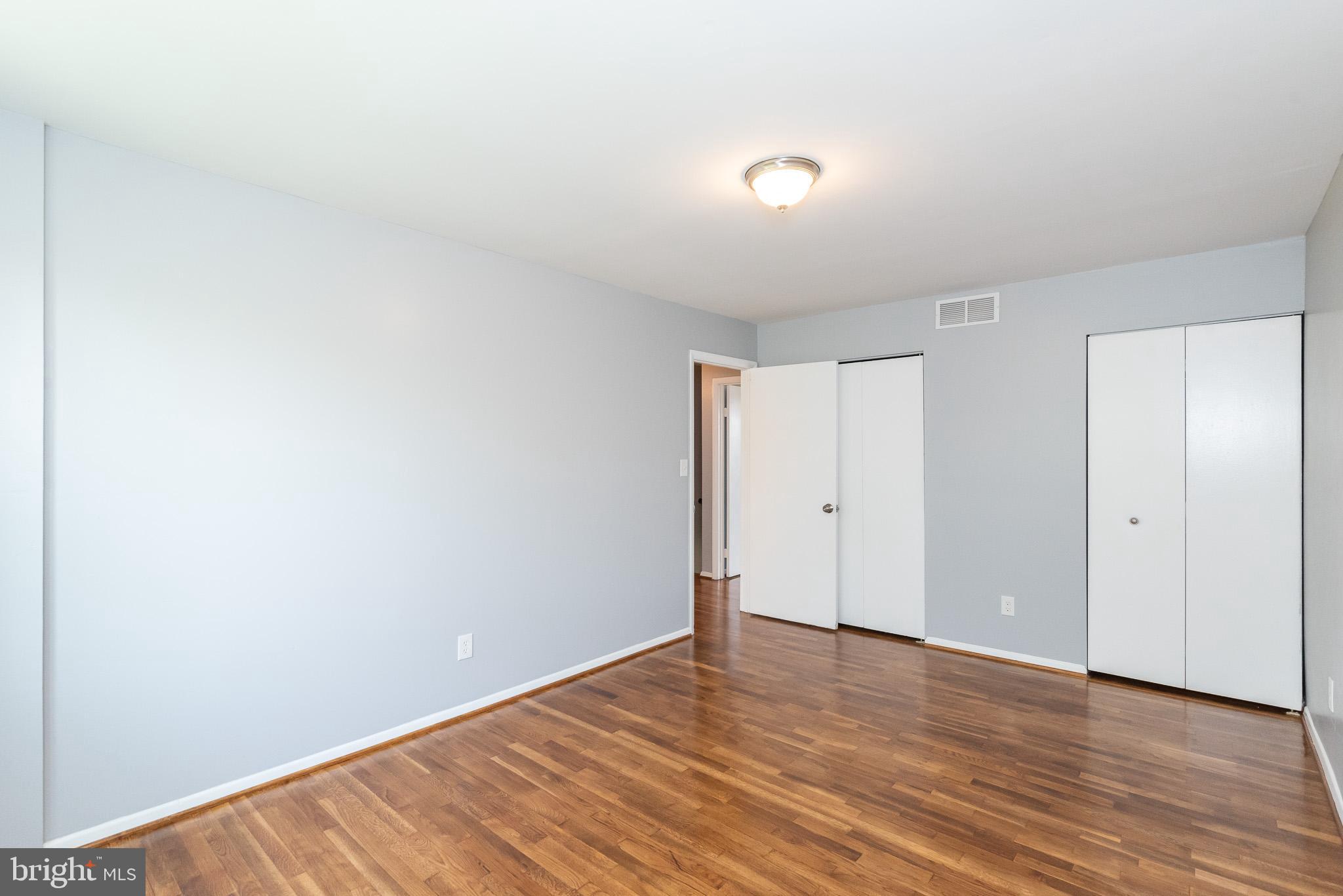 37 Cardor Court, Unit 37 Baltimore, MD 21236 - Photo 31 of 47 a view of an empty room with wooden floor