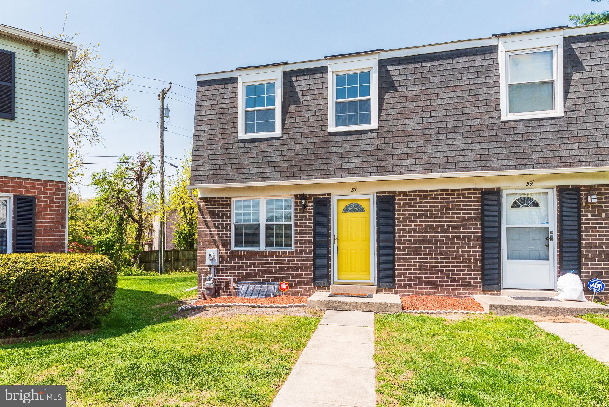 37 Cardor Court, Unit 37 Baltimore, MD 21236 - Photo 45 of 47 a front view of a house with a yard and garage