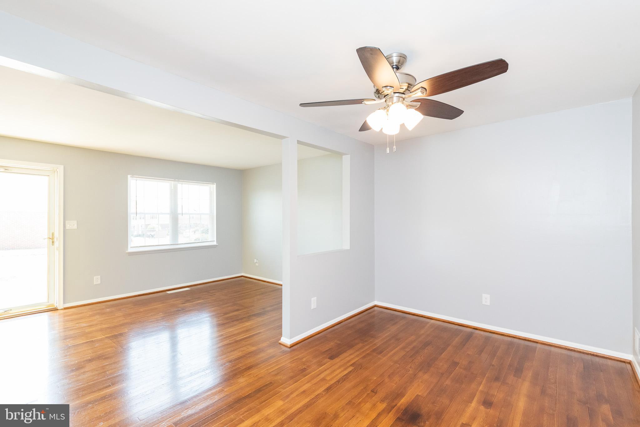 37 Cardor Court, Unit 37 Baltimore, MD 21236 - Photo 6 of 47 a view of an empty room with wooden floor and a window