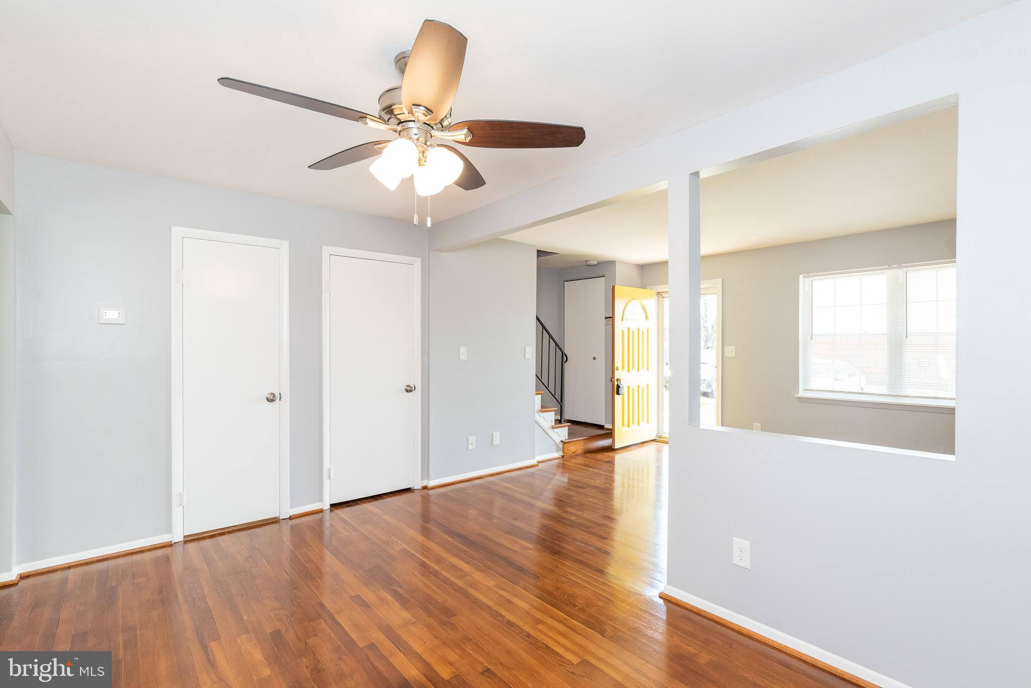 37 Cardor Court, Unit 37 Baltimore, MD 21236 - Photo 7 of 47 a view of an empty room with window and wooden floor