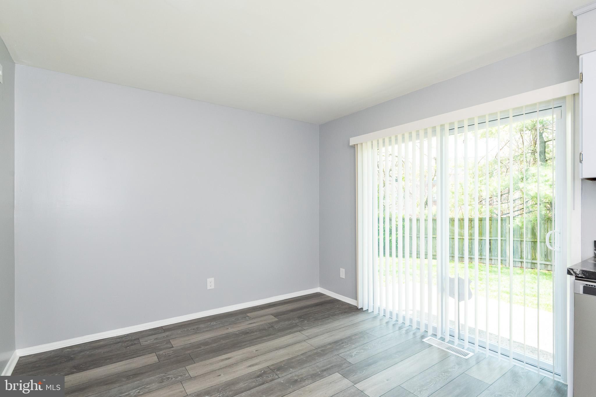 37 Cardor Court, Unit 37 Baltimore, MD 21236 - Photo 10 of 47 a view of an empty room with wooden floor and a window