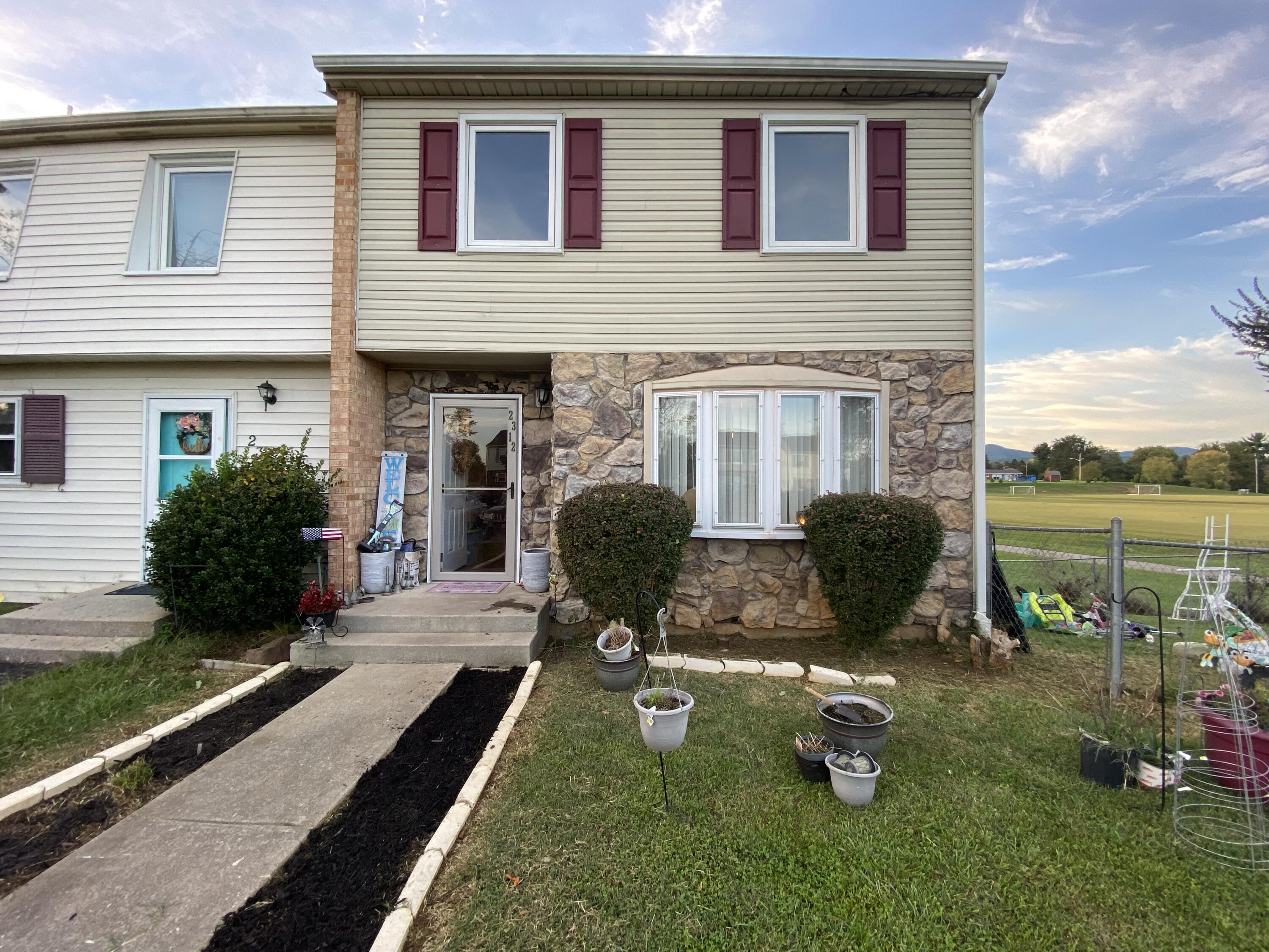 2312 Ranch Road Northwest Roanoke, VA 24017 - Photo 1 of 27 a view of a house with backyard and sitting area